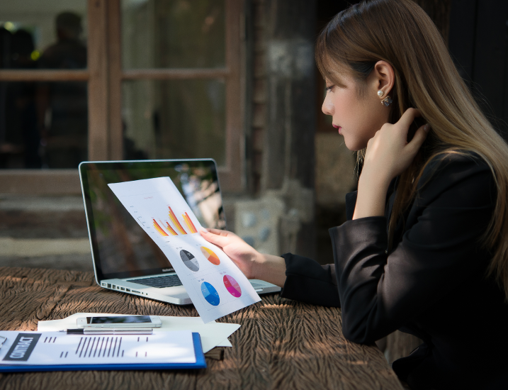 woman-looking-at-charts-and-diagram